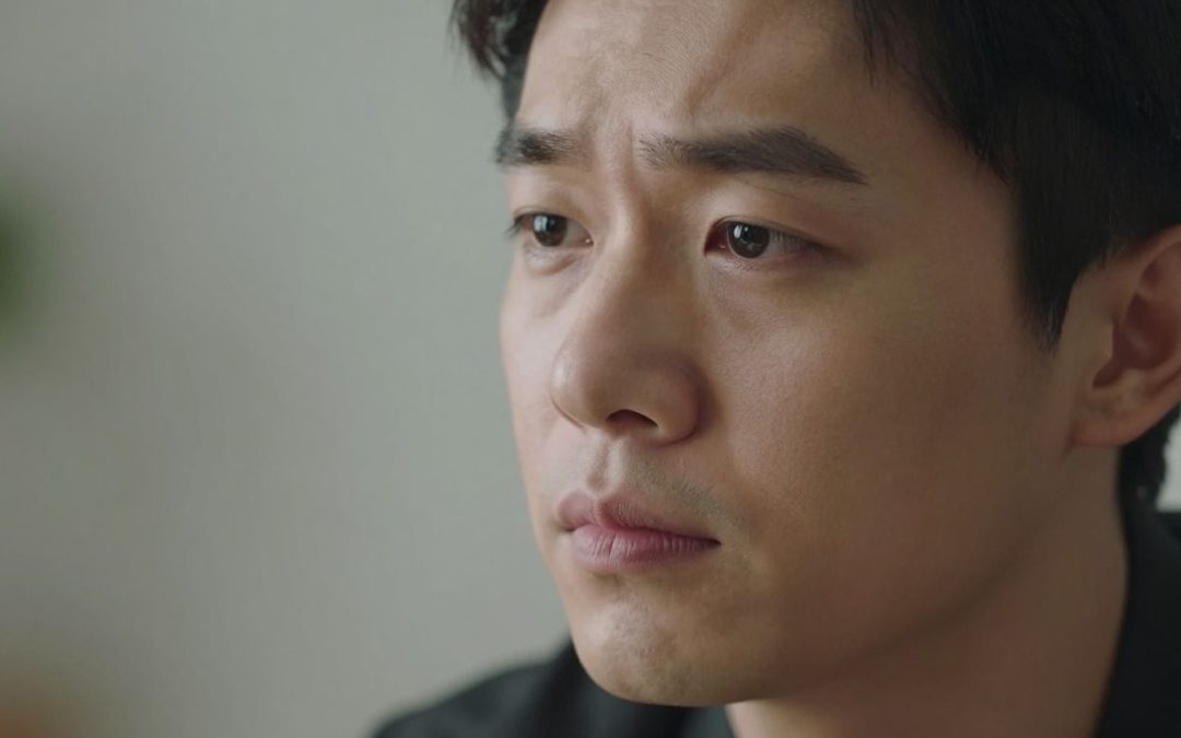 Person's face showing concern and thoughtfulness.