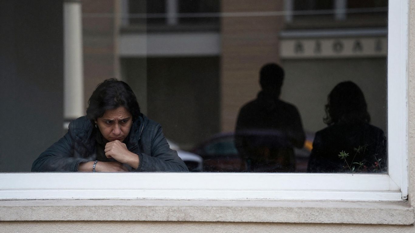 Person looking for a detained relative at a government building.